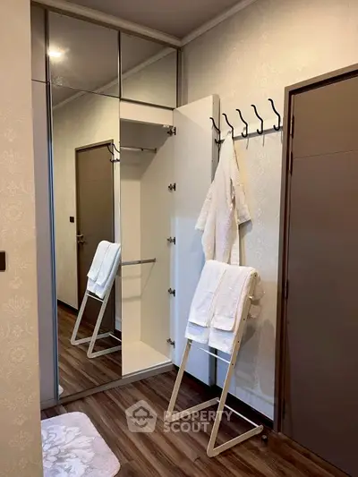 Modern bathroom with elegant mirror and towel rack