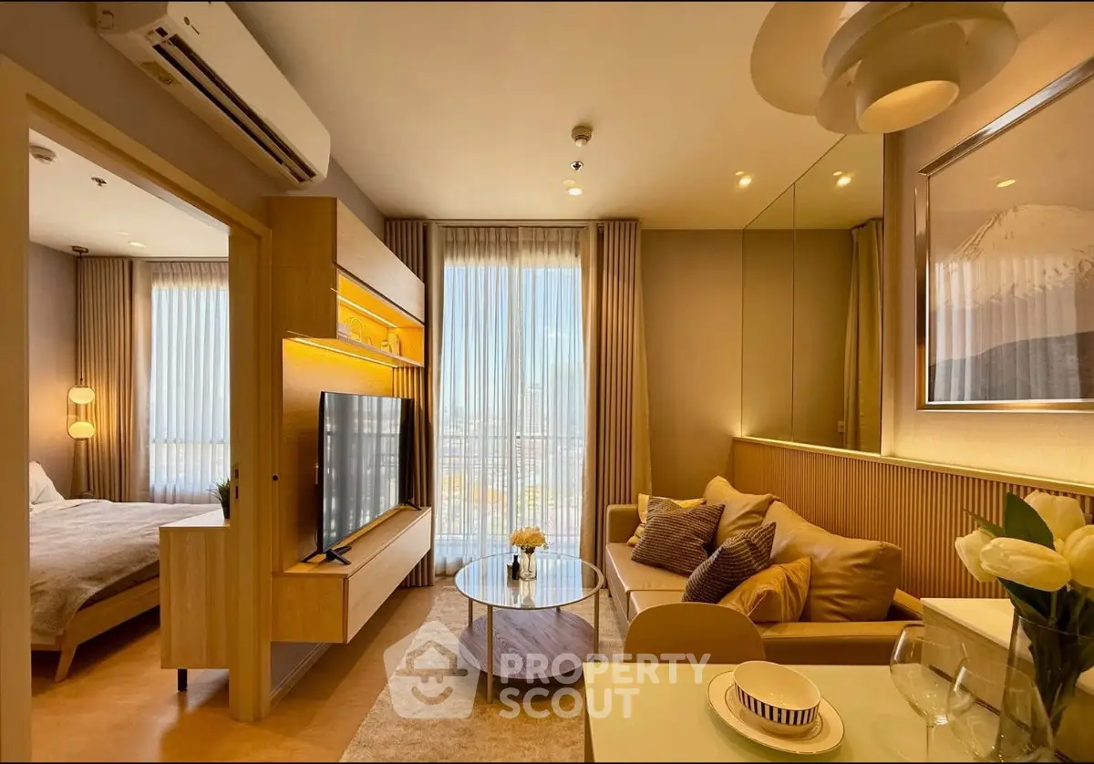 Luxurious modern living room with elegant decor and large windows offering stunning city views.