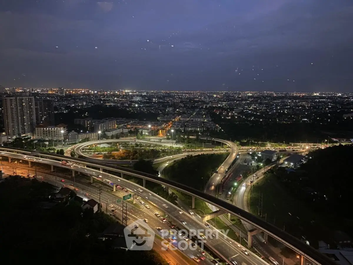 Stunning cityscape view with illuminated highways and urban skyline at night