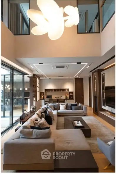 Luxurious modern living room with elegant lighting and spacious seating area, perfect for entertaining.