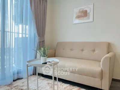 Cozy living room with beige sofa and modern decor