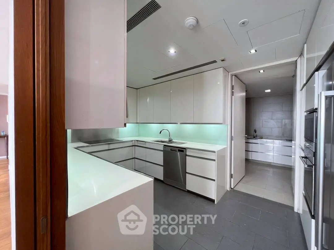 Modern kitchen with sleek cabinetry and integrated appliances