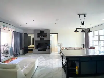 Spacious modern living room with open kitchen and stylish decor