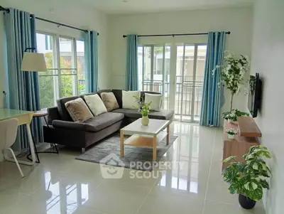 Bright and modern living room with large windows and stylish decor