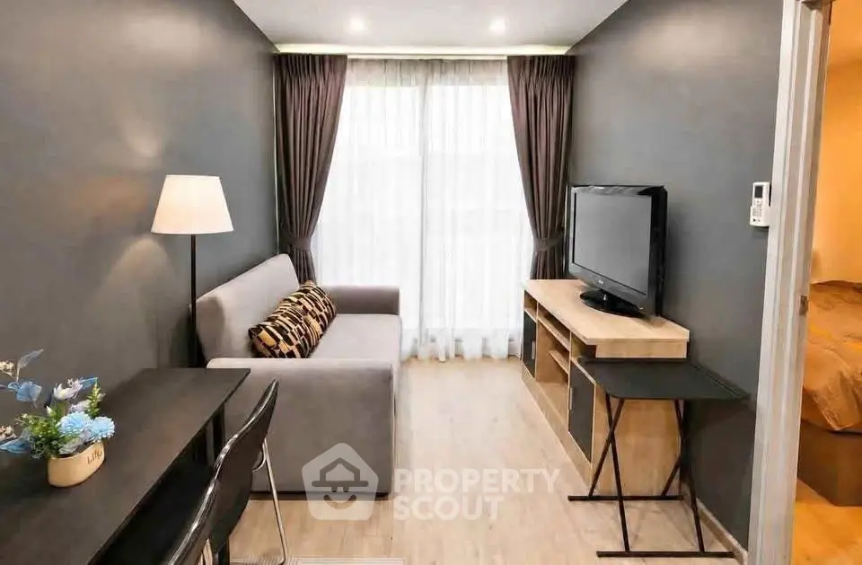 Modern living room with sleek furniture and natural light, perfect for urban living.