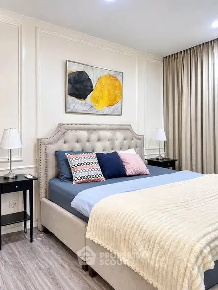 Elegant bedroom with plush bed, stylish decor, and soft lighting creating a cozy ambiance.