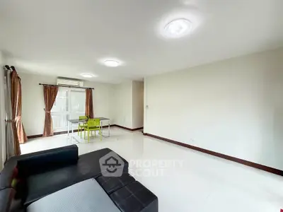 Spacious living room with modern furniture and natural light