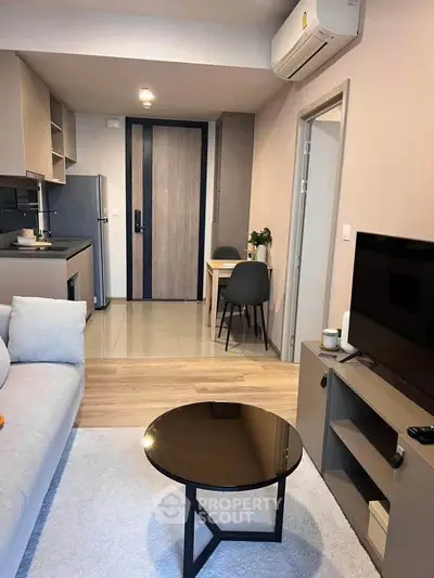 Modern living room with open kitchen in stylish apartment