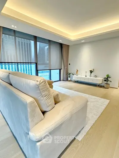 Spacious modern living room with city view and elegant decor