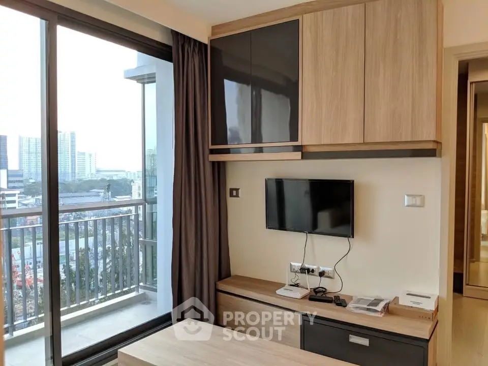Modern living room with balcony view in urban apartment