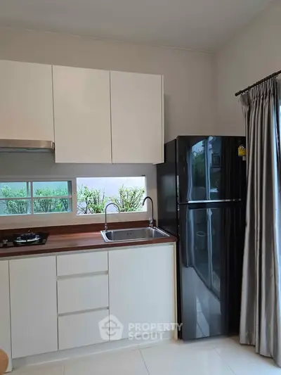Modern kitchen with sleek cabinets and stainless steel appliances