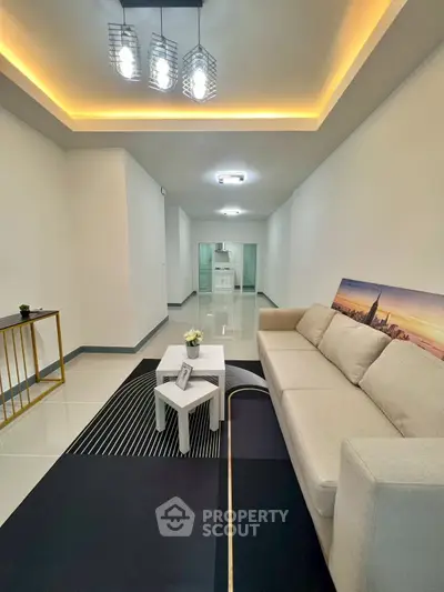 Modern living room with elegant lighting and stylish decor