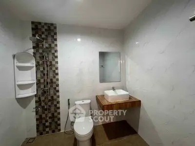 Modern bathroom with sleek fixtures and stylish tile accents