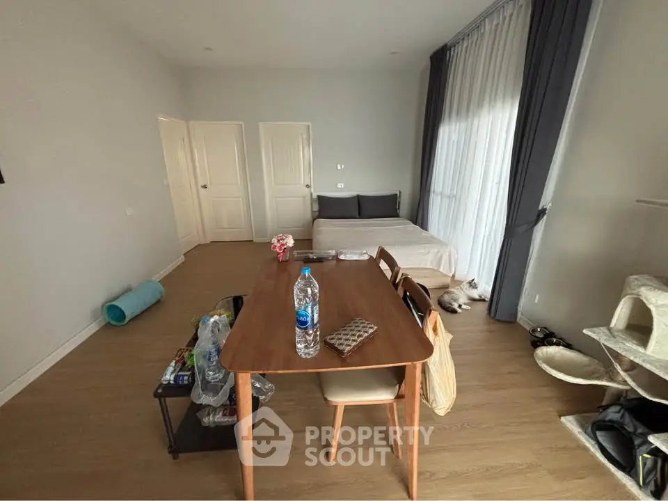 Cozy bedroom with dining table and pet-friendly features, perfect for modern living.