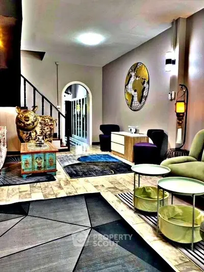 Stylish modern living room with eclectic decor and unique furniture pieces.