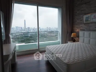 Spacious bedroom with stunning city view and modern decor