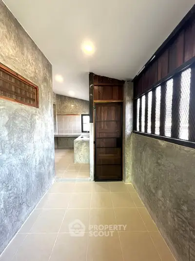 Modern industrial kitchen with open layout and sleek finishes