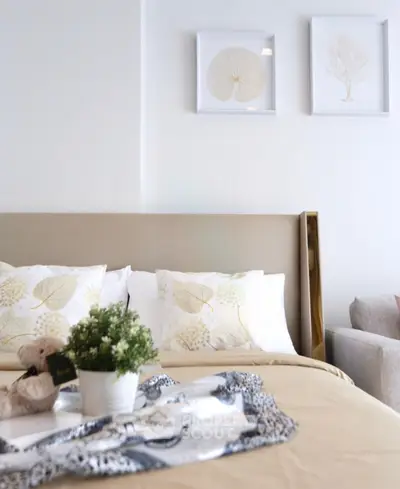 Cozy bedroom with elegant decor and plush bedding, perfect for relaxation and comfort.