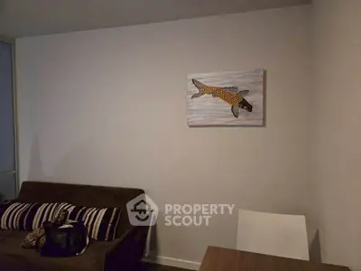 Cozy living room with modern decor and stylish wall art, perfect for relaxation.