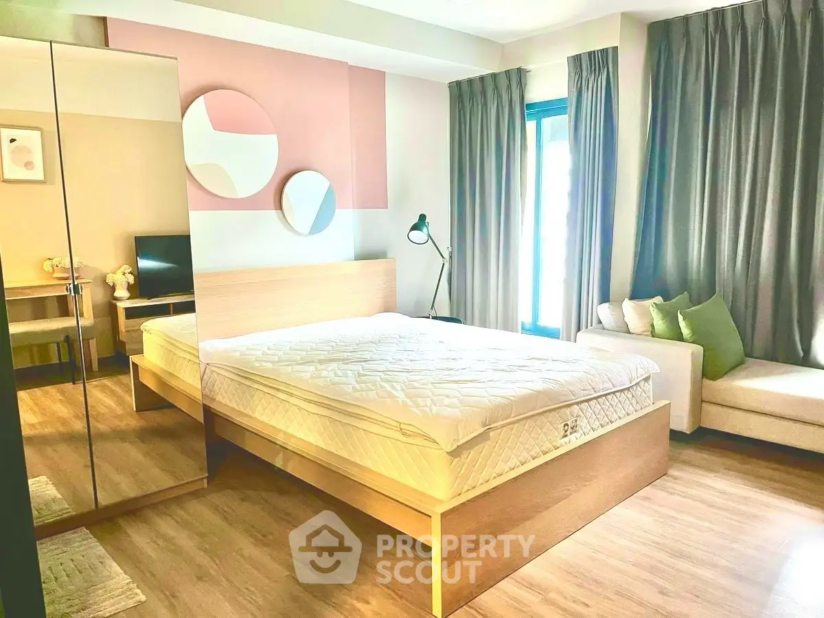 Modern bedroom with stylish decor and natural light