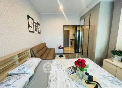 Modern bedroom with stylish decor and cozy seating area