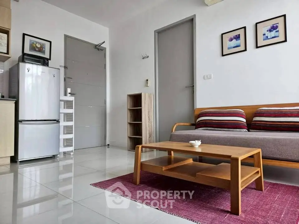Modern living room with stylish furniture and sleek design, featuring a cozy sofa and contemporary decor.