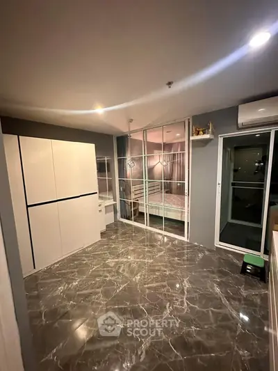Modern interior with marble flooring and glass partition in a stylish apartment