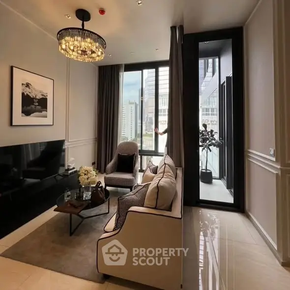 Luxurious living room with elegant decor and city view, featuring a chic chandelier and modern furniture.