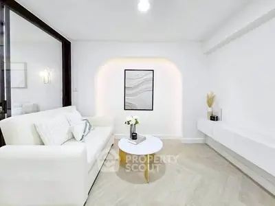 Modern minimalist living room with white sofa and elegant decor