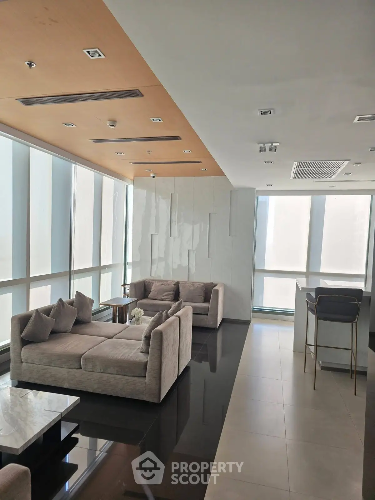 Luxurious modern living room with elegant sofas and panoramic windows