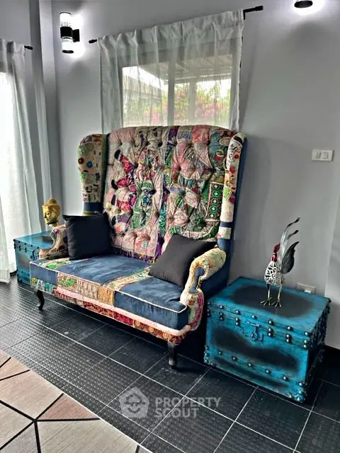 Eclectic living room with colorful patchwork sofa and unique decor