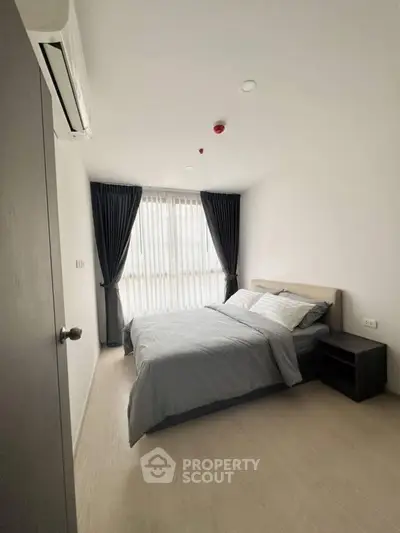 Modern bedroom with natural light and minimalist decor