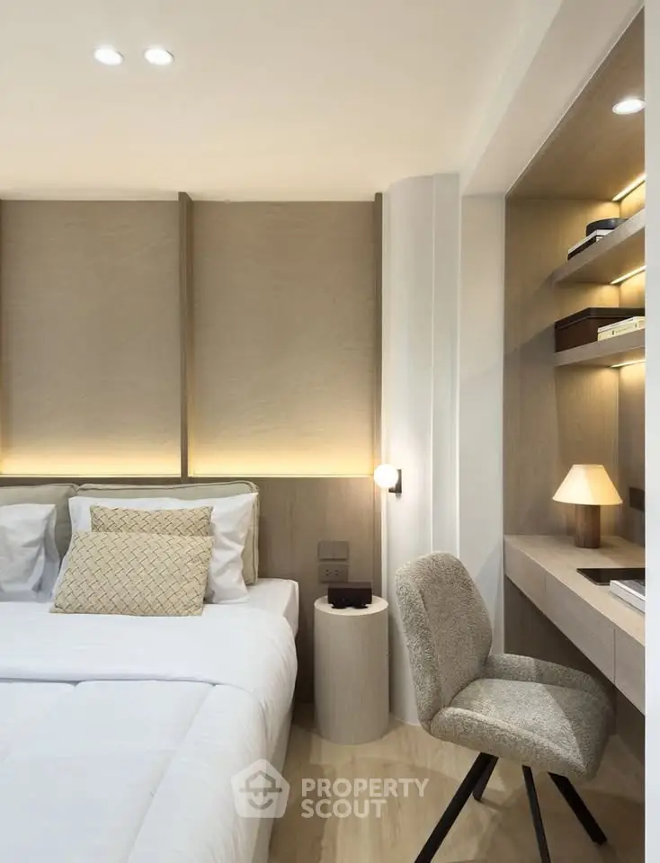 Modern bedroom with cozy study nook and elegant lighting