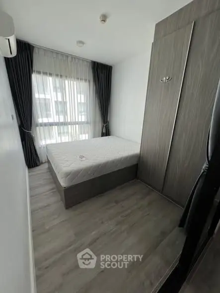 Modern minimalist bedroom with sleek design and natural light