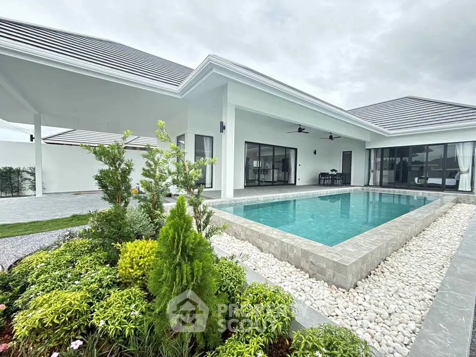 Luxurious modern villa with private pool and lush garden