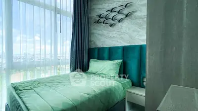 Modern bedroom with large window and stylish decor in high-rise apartment.
