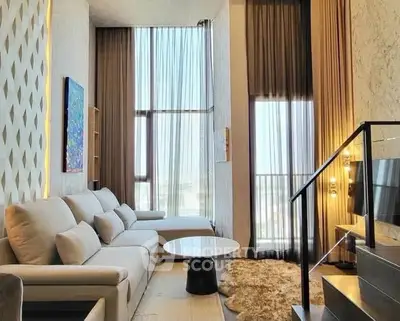 Luxurious modern living room with high ceilings and elegant decor