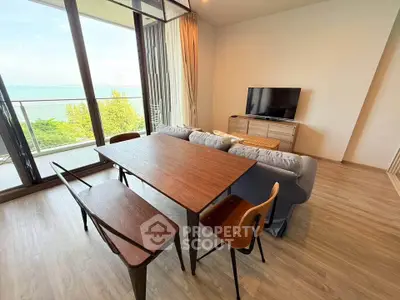 Modern living room with stunning sea view and stylish furniture