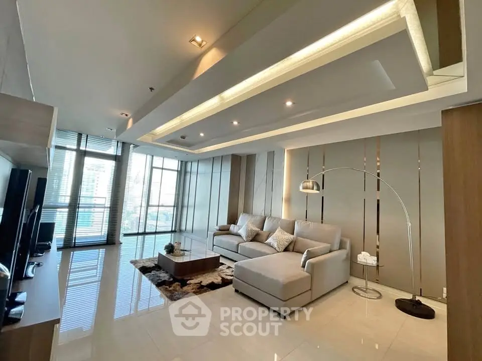 Luxurious modern living room with sleek design and ample natural light