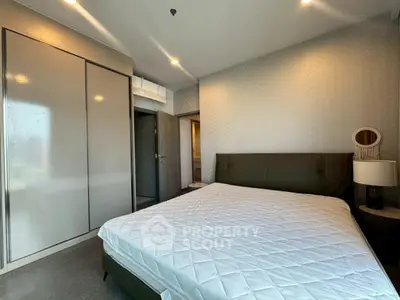 Modern bedroom with sleek design and ample natural light