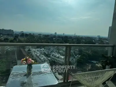 Stunning balcony view with cityscape and mountains, perfect for relaxation.