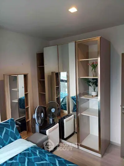 Modern bedroom with mirrored wardrobe and stylish decor