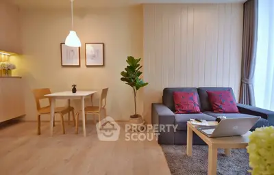 Modern living room with cozy sofa, dining area, and stylish decor