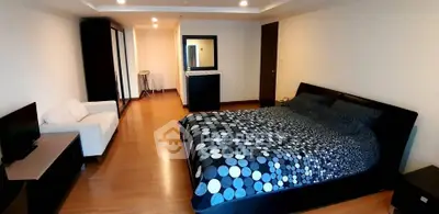 Spacious bedroom with modern decor and cozy ambiance