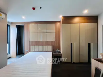 Modern bedroom with sleek design and ample natural light