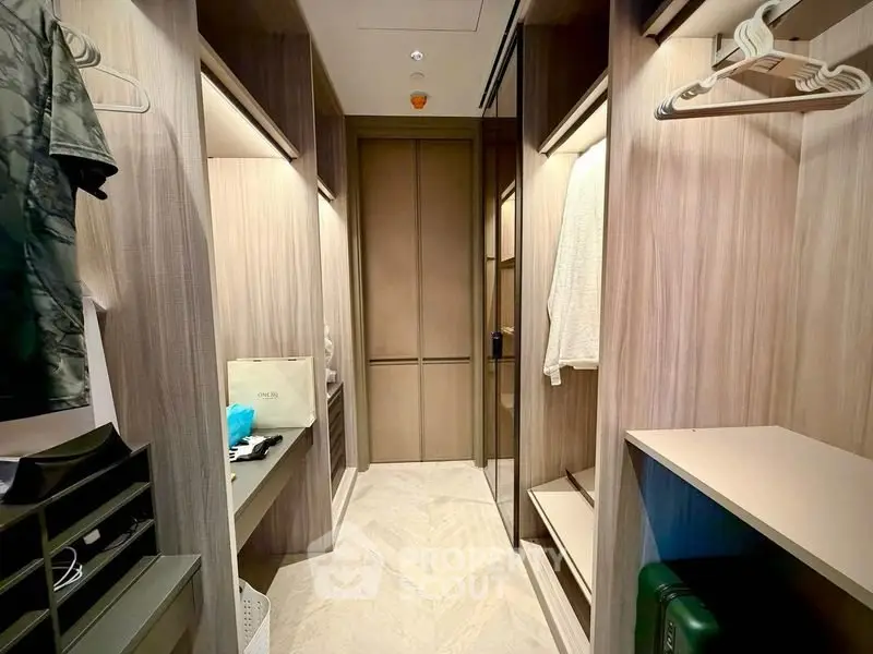 Luxurious walk-in closet with ample storage and elegant design