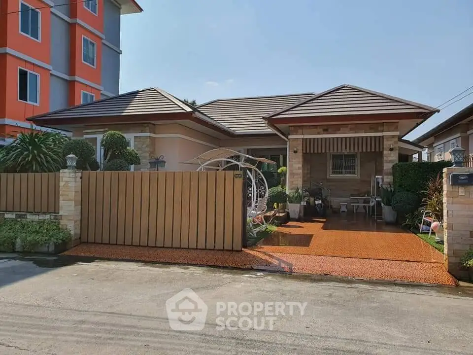 Charming single-story house with landscaped front yard and modern design.