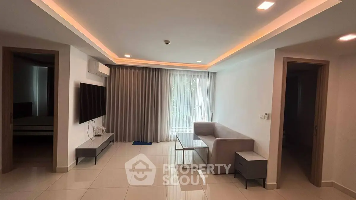 Modern living room with sleek furniture and ambient lighting