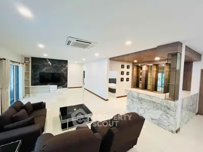 Spacious modern living room with marble accents and open layout