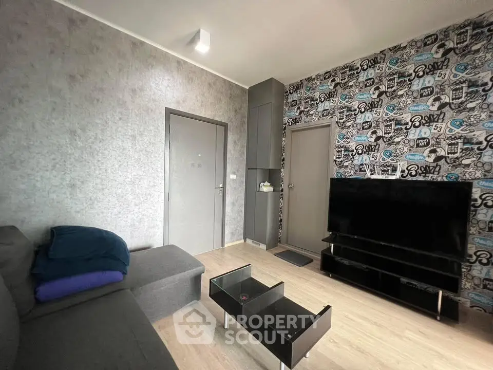 Modern living room with stylish wallpaper and sleek furniture